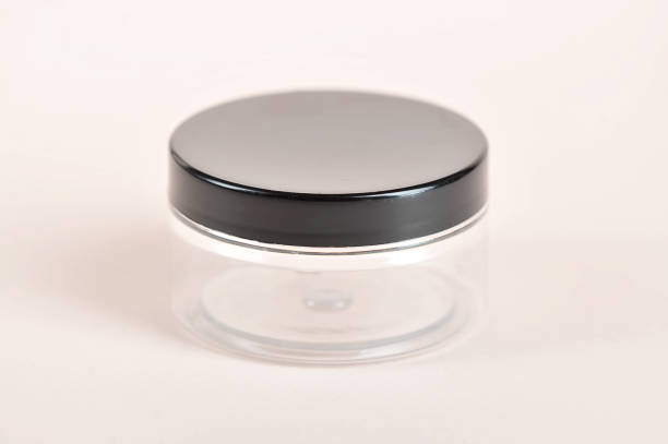 istock Plastic transparent jar with a black lid for cosmetic cream or gel. Side projection. 1163674349