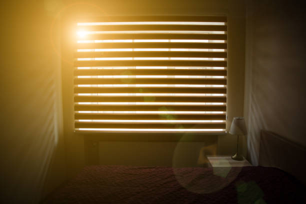 istock Window blinds indoors. Room interior design. Simple lines and lights. 1163676046