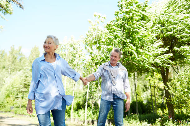 istock Senior Woman Leading Husband in Nature 1163677912