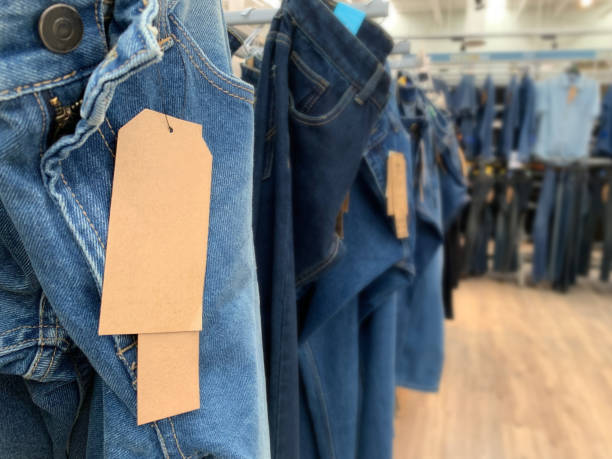 istock blue denim jeans trouser with paper tags for sell 1163679097