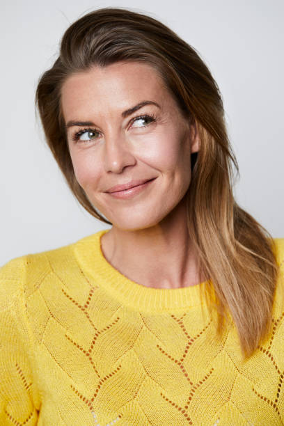 istock Smiling woman looking away 1163682909