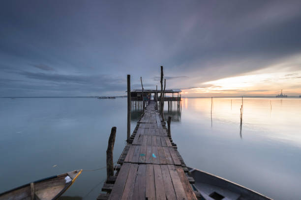 istock Pier Over Sea Against Sky During Sunset 1163683043