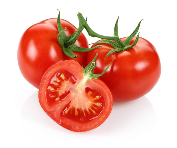 istock Half and whole fresh tomatoes isolated on white 1163694420
