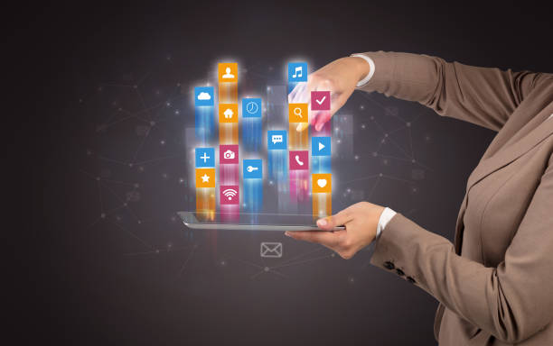 istock Classic application icons coming out from tablet 1163694715