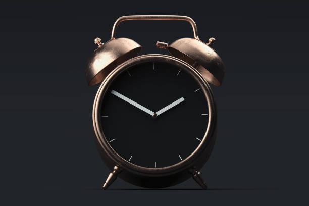 istock Golden realistic alarm clock isolated on black background. 3d rendering. 1163695448