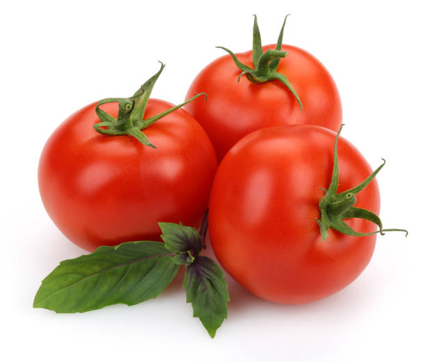 istock Fresh tomatoes and basil leaves isolated 1163695481