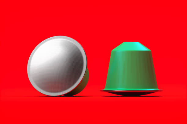 istock Realistic blank espresso coffee capsules isolated on red background. 3d rendering 1163695514