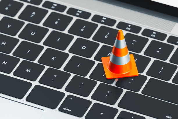 istock Close up of keyboard and traffic cone on it. 3d rendering. 1163695559