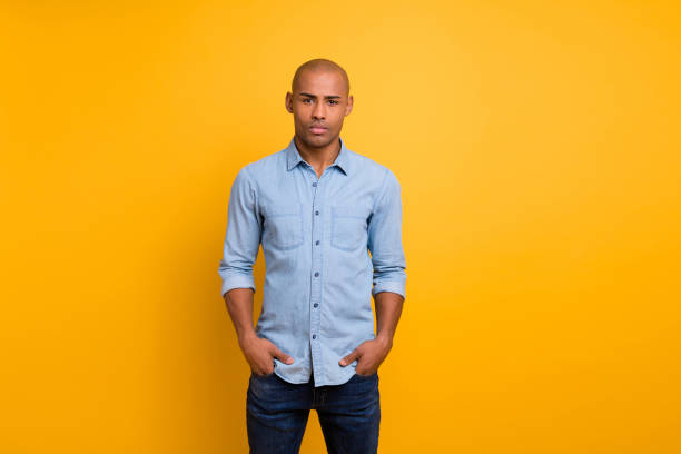 istock Portrait of nice guy hands pockets look isolated over yellow background 1163695612