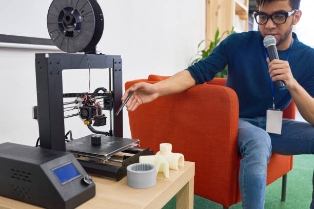 istock Crop man speaking and showing invention 1163696088