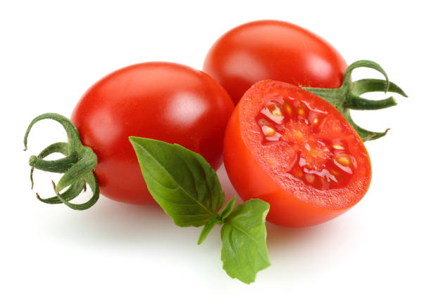 istock Cherry tomatoes and mint leaves isolated 1163696101