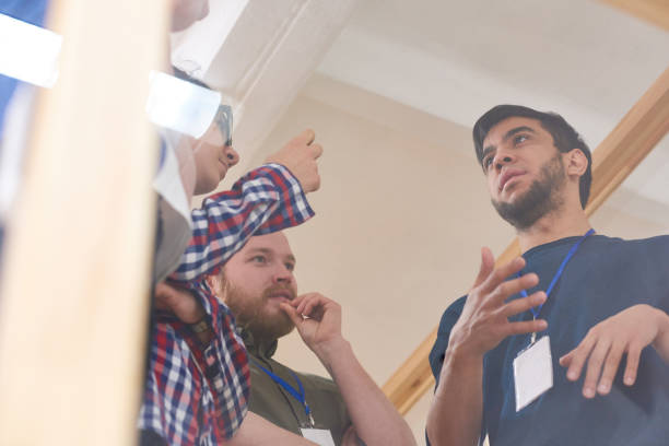istock Men discussing new ideas in office 1163696478