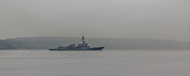 istock Guided-missile Destroyer on foggy Bay 1163699046