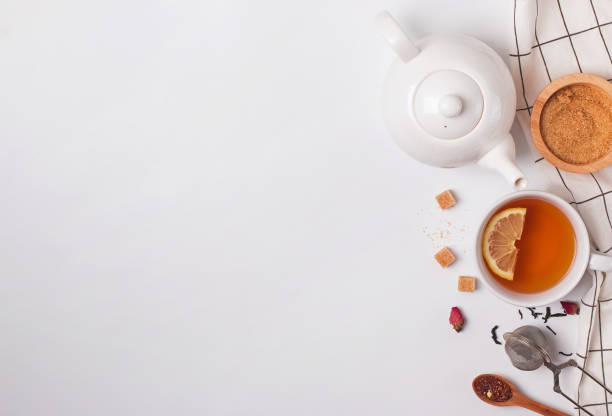 istock Cup, teapot and sugar on the white background, top view 1163702304