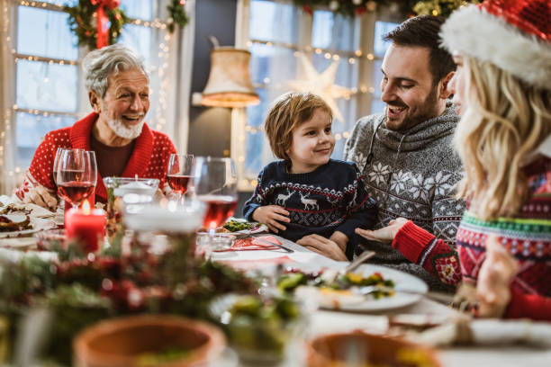 istock Happy extended family talking during a meal on New Year. 1163702998