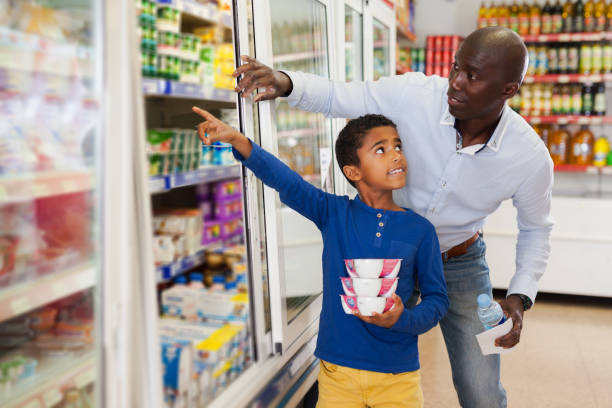 istock African American man with his son making purchases 1163704407