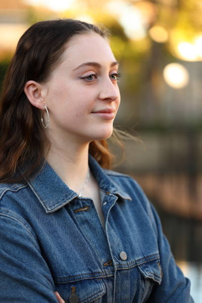 istock Smiling young woman in the afternoon sun 1163704488
