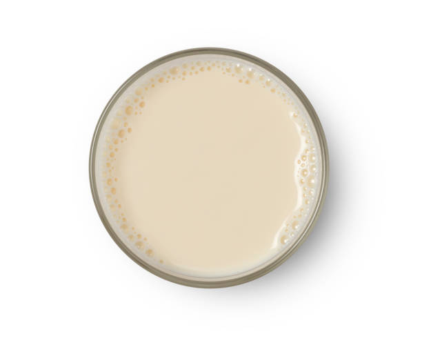 istock Cup with soy milk bubble foam top view 1163705482