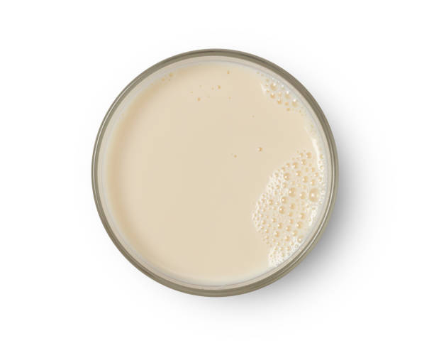 istock Cup with soy milk bubble foam top view 1163705561