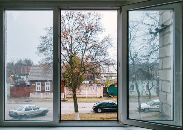 Cityscape view through big window in room.