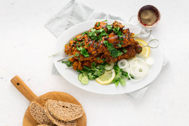 istock Kebab roasted on the grill on white plate on white background top view 1163706159