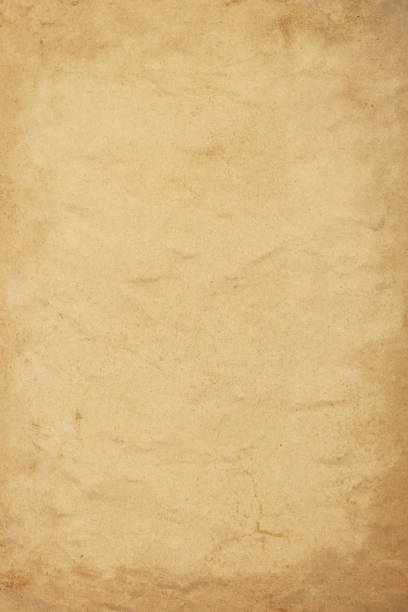 istock Old vintage brown paper parchment background 1163707039