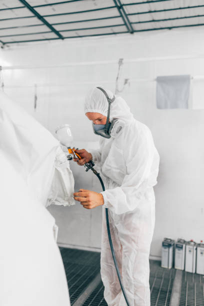 istock Man working in car painting chamber. 1163707118