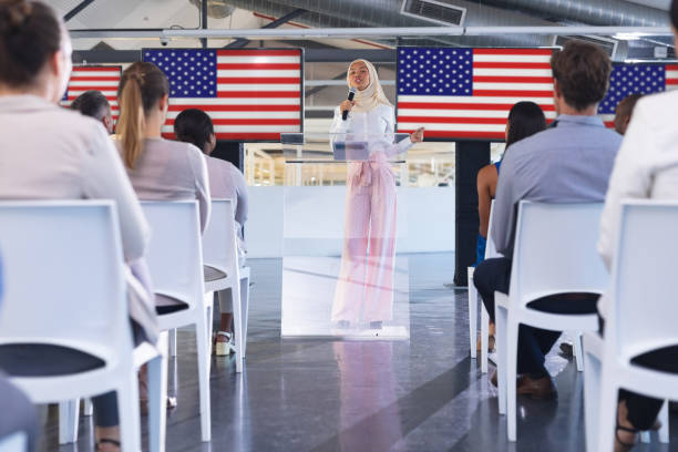 istock Female speaker speaks in a business seminar 1163707197