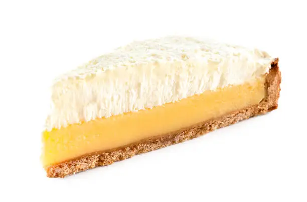 Slice of lemon meringue pie isolated on white.