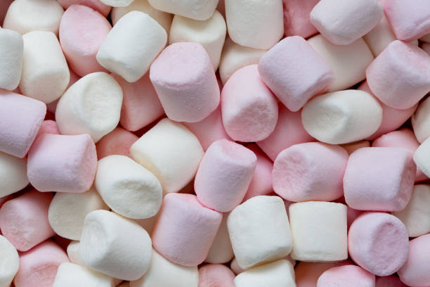 istock Background of pink and white mini marshmallows from above. 1163707509