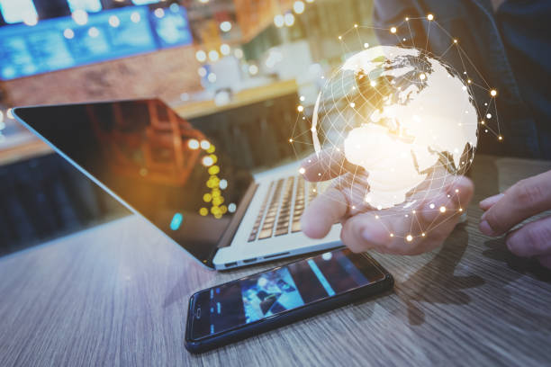 istock Globalization conceptual of technology use laptop and smartphone, wireless internet connection every where 1163712050