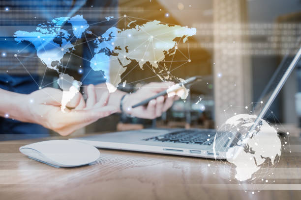 istock Globalization conceptual of technology use laptop and smartphone, wireless internet connection every where 1163712053