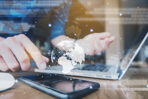 istock Globalization conceptual of technology use laptop and smartphone, wireless internet connection every where 1163712056