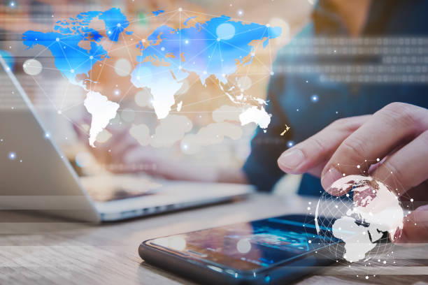 istock Globalization conceptual of technology use laptop and smartphone, wireless internet connection every where 1163712058