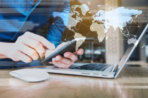 istock Globalization conceptual of technology use laptop and smartphone, wireless internet connection every where 1163712059