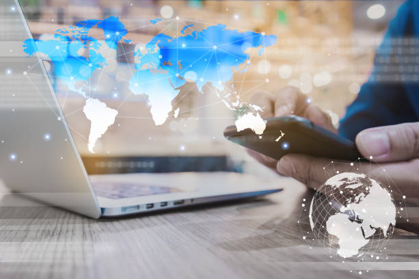 istock Globalization conceptual of technology use laptop and smartphone, wireless internet connection every where 1163712060