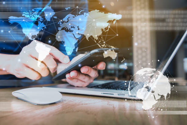istock Globalization conceptual of technology use laptop and smartphone, wireless internet connection every where 1163712061