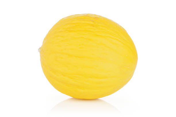 Yellow canary melon isolated on white One whole bright fresh yellow melon canary isolated on white background canary photos stock pictures, royalty-free photos & images