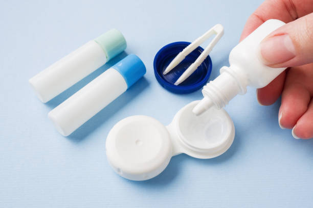 istock Contact lenses, tweezers and a container for storing lenses, containers for solution and moisturizing drops. Close up. Selective focus. 1163717018