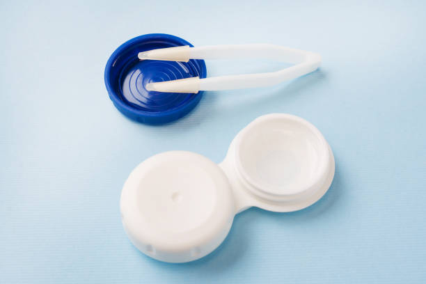 istock Contact lenses, tweezers and lens storage container. Close up. Selective focus. 1163717486