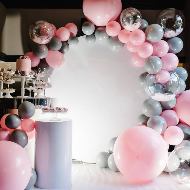 Birthday Cake on a background balloons party decor. Copy space. Celebration concept. Trendy Cake. Candy bar. Table with sweets, candies, dessert. Delicious wedding reception.