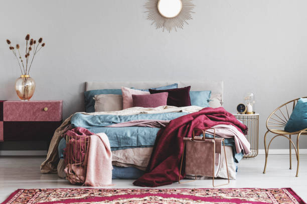 istock Sun shape like mirror above comfortable bed with cozy bedding 1163719153