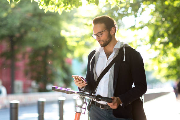 istock Activating electric scooter from smart phone 1163720871