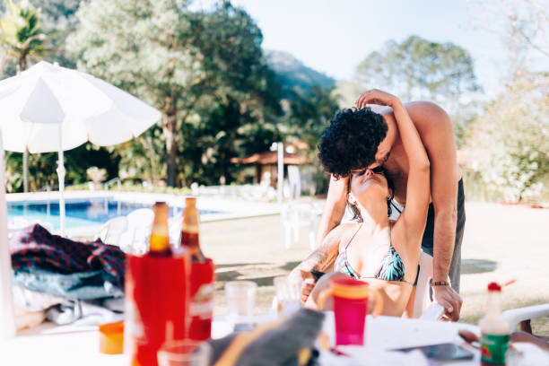 Affectionate couple at swimming pool area