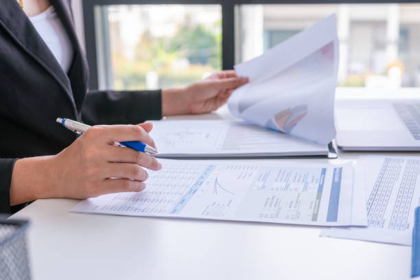 istock Businessman analysis comparing financial reports. Financial reports are set of documents prepared by an administrative team and ceo recheck report profit. Concept business finance 1163722388