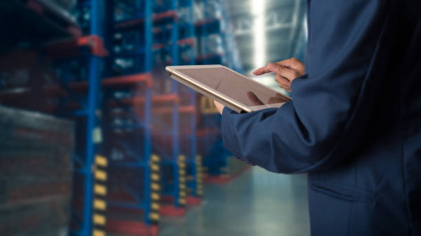 istock Logistic and transport concept : Businessman manager using tablet check and control and planning for Modern Trade warehouse logistics. 1163722439
