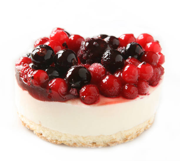 Forest fruit cheesecake isolated on white.