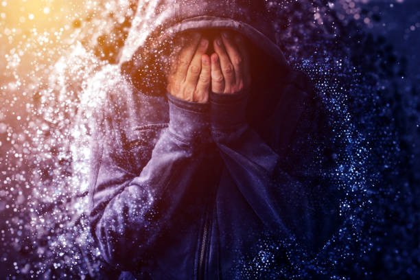 Hopeless addict person crying and dissolving Hopeless addict person crying and dissolving, falling into pieces while going through addiction crisis, violet toned cirque de soleil stock pictures, royalty-free photos & images