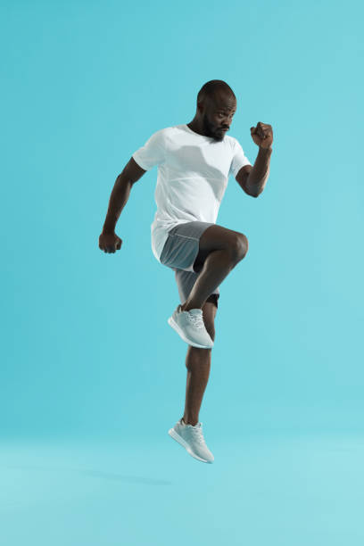 istock Workout. Sports man exercising, running on spot, cardio training 1163726349