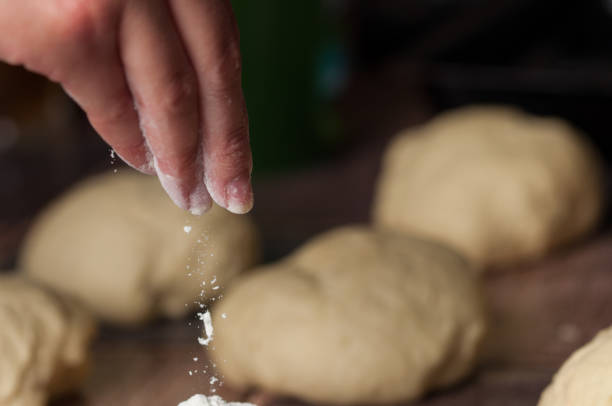 istock Woman making dought.Dought for pizza and bread.Food. 1163726503